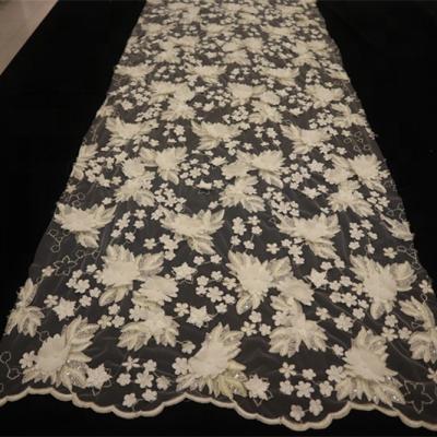 China Viable Good Quality Gorgeous Floral 3D Flowers Embroidered Bridal Lace Fabric With Strings And Sequins for sale