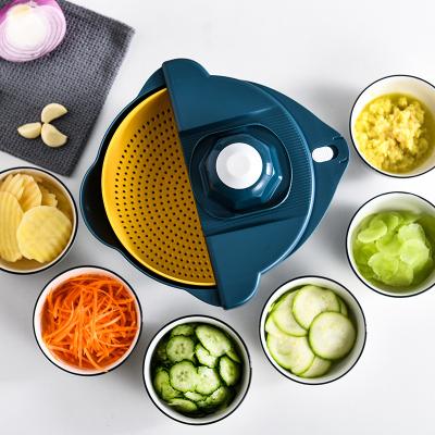 China New Sustainable Round Vegetable Cutter 9 Piece Kitchen Cutter Household Vegetable Cutter With Hand Razor for sale