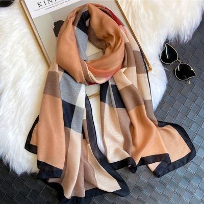 China Autumn and winter antibacterial warm female British plaid printed scarf holiday summer sunscreen beach scarf female dual-function shawl for sale