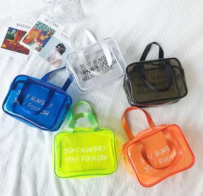 China Custom Clear PVC Waterproof Jelly Storage Zipper Tote Transparent Shopping Candy PVC Ladies Beach Bag for sale