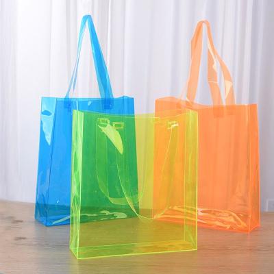 China 100% Eco-Friendly Latest Fashion Extra Large Plastic PVC Transparent Hands Tote Bag for sale