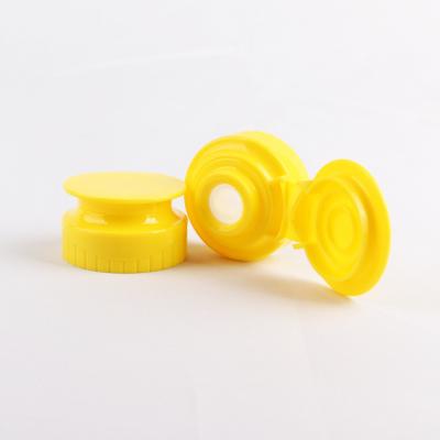 China 38/400 Food Grade Yellow Plastic Silicone Valve Flip Top Cap Squeeze Bottle Flip Honey Cap for sale