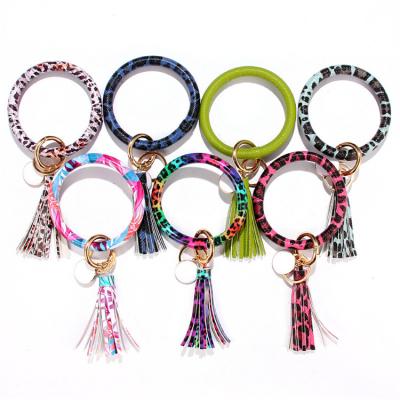 China Wholesale Big Circle O Key Ring Promotion Gift PU Leather Fringe Key Chain Bracelet Wristband With Tassel for sale