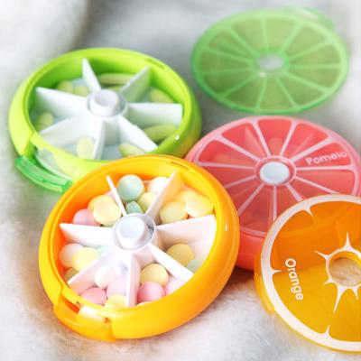 China Eco-friendly ABS Fruit Style 7 Day Smart Rotatable Plastic Round Pill Box Pastillero for sale