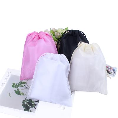 China 25*36CM Recyclable Running Factory Recyclable Non-woven Apparel Gift Ice Cream Drawstring Bags Pink Black Beige for sale