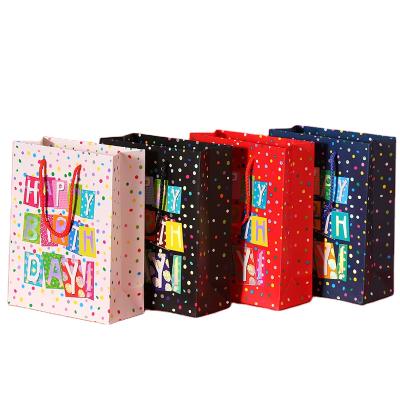 China 4 Color Options Recyclable Colorful Dotted White Orange Blue Black Paper Bags 17*23CM Birthday Paper Bags for sale