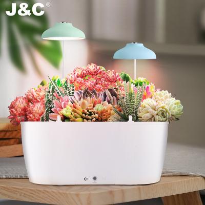 China Easy assemble smart garden pot wifi control planter indoor garden flower pot with self water spray spout for sale