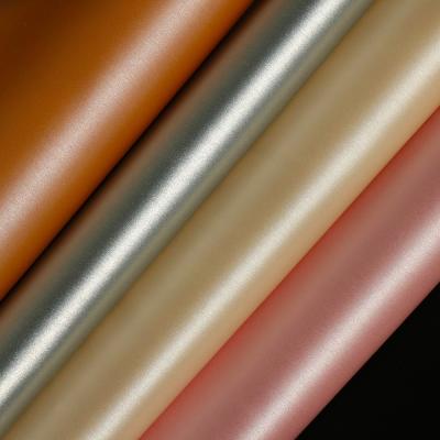 China Abrasion-resistant PU embossed leather fabric for making bags, shiny PU leather foiled for sale