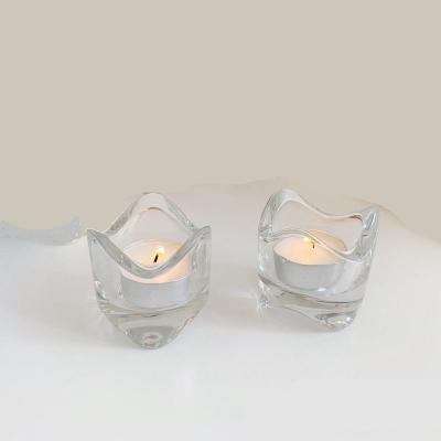 China Simple modern romantic simple style irregular wave shape small tea light tealight glass candle holder for sale