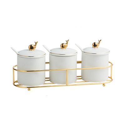 China Viable Porcelain Gold Design Kitchen Storage Bottles With Lid Reservoir Set Salt Shaker Sugar Bowl Spice Jar Set for sale