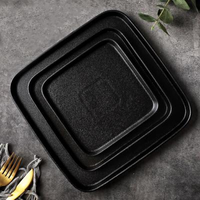 China Viable In Restaurant Running Place Form Matte Black Ceramic Dinner Plate for sale