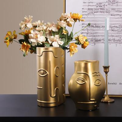 China Art Nordic Ceramic Gold Face Vase Porcelain Creative Modern Modern Abstract Ceramic Vases For Home Decoration for sale