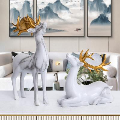 China Modern Art Modern Office Living Room Decor Home Decor 2pcs White Gold Marbling Brass Brass Deer With Ball For Home Decoration for sale