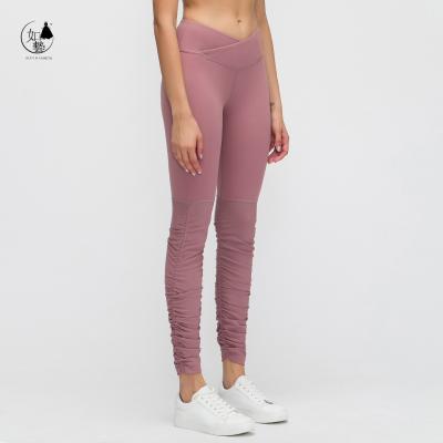 China 2021 autumn and winter new style breathable high waist yoga pants with cross waist and slim bodybuilding for sale