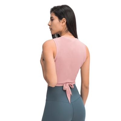 China 2021 New Summer Waist Strap Yoga Vest Solid Color Cross Front Breathable Spring And Sweat Fitness Yoga Wicking Suit for sale