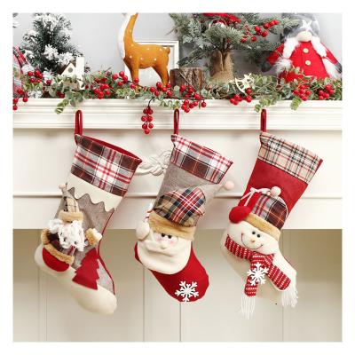 China Christmas 2021 Old Man Snowman Santa Claus Socks Holiday Candy Bag Non-Woven Fabric Christmas Stocking Gift Pendant for sale