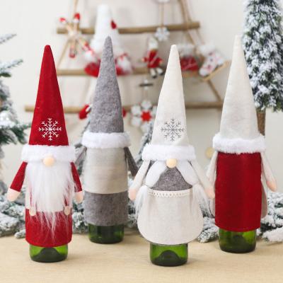 China 2022 Economic Felt Nonwoven Fabric Mini Santa Old Man Christmas Hats Gnome Wine For Christmas Wine Bottle Decoration for sale