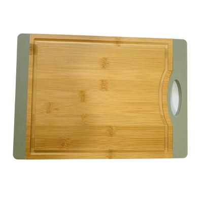 China Sustainable Amzaing Bamboo Cutting Serving Board With Silica Gel Handle For Fruit Meat And Vegetable for sale