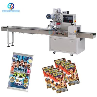 China CLOTHING Automatic Horizontal Flow Packing Machine Game Card Wrapping Machine For Small Toy for sale