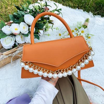 China Luxury Designer Handbags Famous Brands 2021 New Simple Soft Handbags Fashion Triangle Cover Shoulder Crossbody Lady Bags Handbags With Pearl Chain for sale