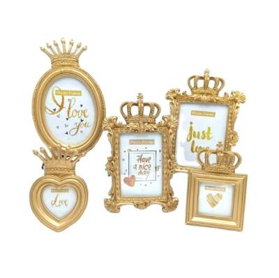 China Luxury Golden Luxury Resin Picture Frame Props Wall Mounted Wall Gallery Picture Frame Table Display for sale