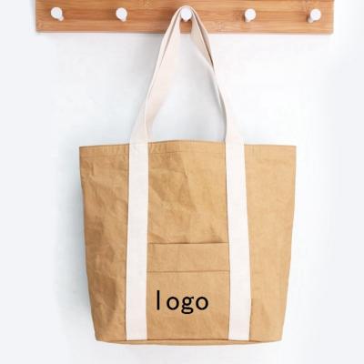 China Water Proof Custom Logo Tote Bag Biodegradable Washable Paper Reusable Shopping Bags for sale