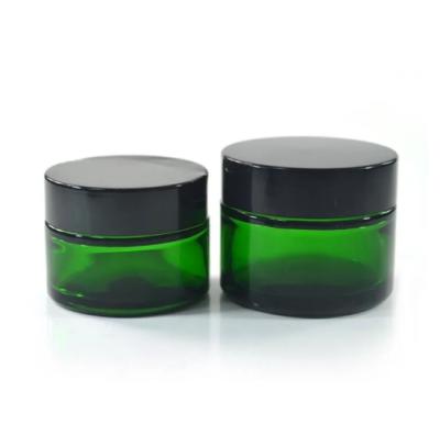 China Amber Frosted Transparent Clear Black Glass Green Cream Glass Jar Wholesale Cosmetic Bottle With Plastic Aluminum Cap for sale