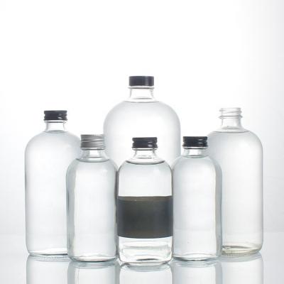 China 250ml 500ml Beverage Stored Flint Round Boston Clear Glass Drinking Water Bottle With Screw Top for sale