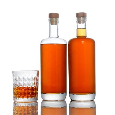 China Customized logo empty beverage 700ml 750ml cachaca XO spirits liquor glass bottles for sale