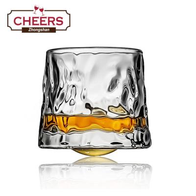 China Manufacturer Unstable Rotatable Whiskey Glass Viable Set, Bar Crystal Spherical Bottom Rocks Glass for sale