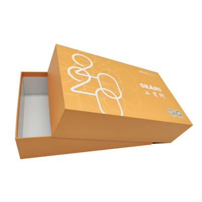 China BEAUTY PACKAGING factory price two pieces of hard paper rigid box with orange base for gift packaging for sale