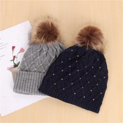 China Hot JOINT Ladies Knit Beanie With Pom Pom Winter Hat Winter Hat Knitted Beanie Customized High Quality for sale