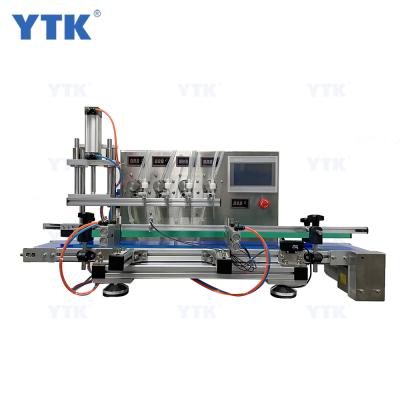 China Food YTK 4 Heads Automatic Magnetic Pump Bottles Water Filler Essential Oil Perfume Liquid Filling Machine for sale