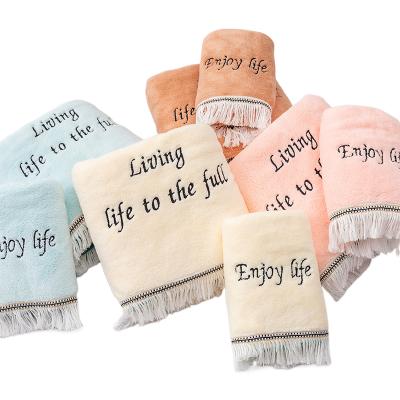 China Yellow letters embroidery terry cloth factory price fleece bath towel coral washcloth safe for correction children for sale