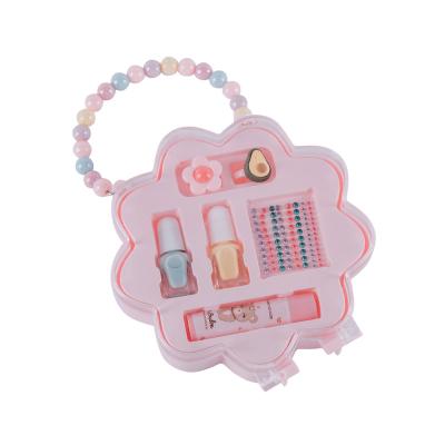 China Waterproof Flower Box Kids Cosmetics Set with Nail Polish Lip Balm Drill Stickers and Ring Make Up Kit for sale