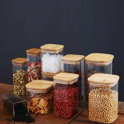 China Fresh Preservation Kitchen Canisters Square Glass Food Storage Jars With Bamboo Wooden Lids For Sugar Candy Dried Fruit Sealed Containers Set for sale