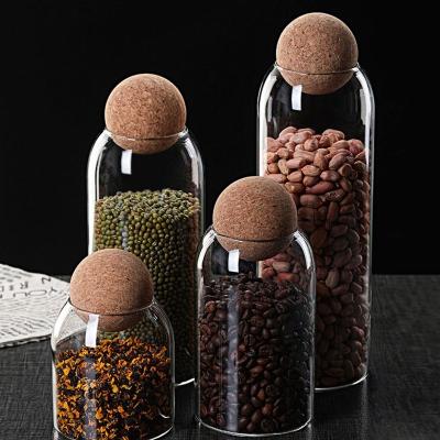 China ODM/OEM Amazon Canister Viable Hot Glass Food Storage Jars With Wooden Lid Cork Ball Stopper for sale