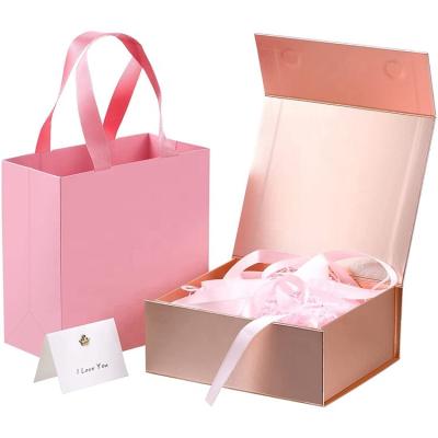 China Recycled Materials Custom Luxury Pink Magnetic Wedding Packaging Boxes High End Valentine's Day Cosmetics Gift Box With Ribbon for sale