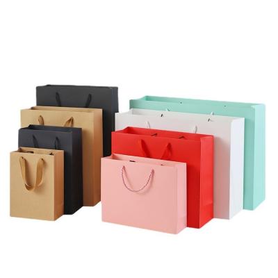 China Recyclable Wholesale Eco Friendly Retail Kraft Paper Shopping Bag Plain Coated Paper Bag On Stock for sale