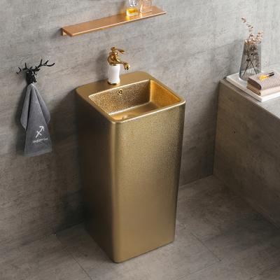 China Hotel Modern Ceramic One Piece Gold Sink Basin Toilet Bathroom Sink Pedestal Bathroom Sink Gold Color Round Shape for sale