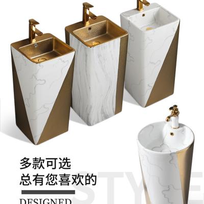 China Modern Ceramic Gold Color Counter Top Basin Round Shape Bathroom Sink Pedestal Hotel Toilet Hand Basin for sale