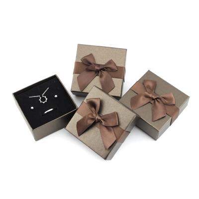 China Recycled Materials Hardcover Cardboard Paper Small Lovely Custom Jewelry Box With Ribbon for sale