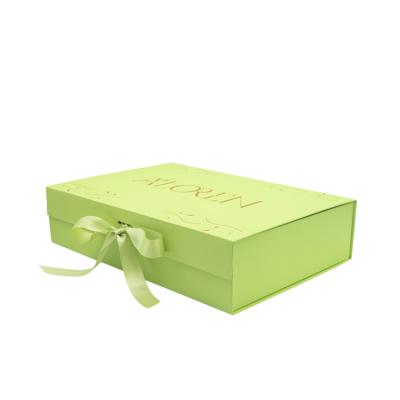 China Recyclable Custom Logo Luxury Cardboard Magnetic Folding Gift Box With Ribbon Closure for sale