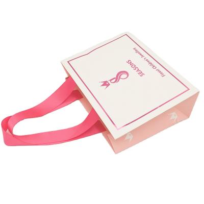 China Recycled materials custom personalized paper bag design /small fancy paper gift bags with handle ribbon for sale