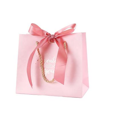 China Recyclable High End Custom Logo Die Cut Handle Paper Gift Bag With Ribbon Bow for sale