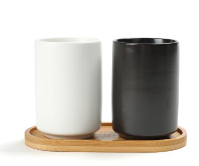 China Black And White Couple Cylinder Cylinder Tooth Cup Ceramic Mouthwash Sustainable Homestay Hotel Brushing Mug With Holder Ceramic Cup Black And White for sale