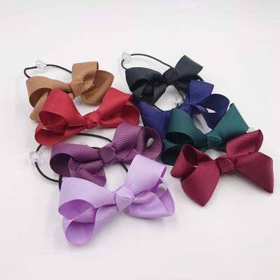 China Dailry 2018 New Style Girls Hair Accessories Grosgrain Hair Bows With Beaded Elastic Band for sale