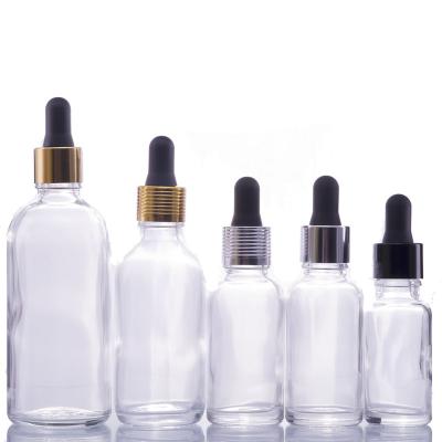 China Wholesale Luxury Clear Glass Essential Oil Perfume Bottles 15ml 20ml 30ml Screw Lid With Dropper Cap for sale