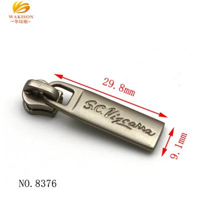 China High quality nickel free metal zipper puller with engrave logo for sale