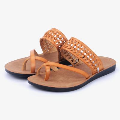 China Pigskin Flip Flop Female Summer Flat Bottom Beach Shoes Fashion Clip Border Hollow Slippers New for sale